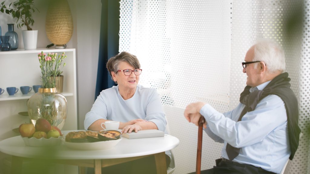 A man and a woman talking
